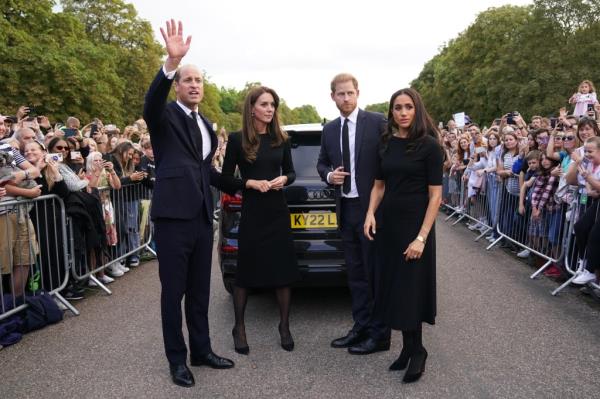 Prince William, Catherine, Prince Harry, and Meghan greeting the public outside of Windsor Castle
