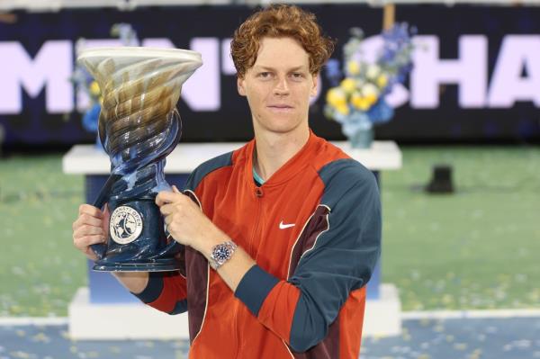 Jannik Sinner of Italy poses with the Rookwood Cup after defeating Frances Tiafoe of the United States during the men's final of the Cincinnati Open at the Lindner Family Tennis Center on August 19, 2024 in Mason, Ohio.  