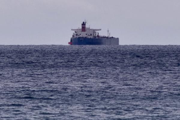 The seized Russian-flagged oil tanker Pegas is seen anchored off the shore of Karystos, on the Island of Evia
