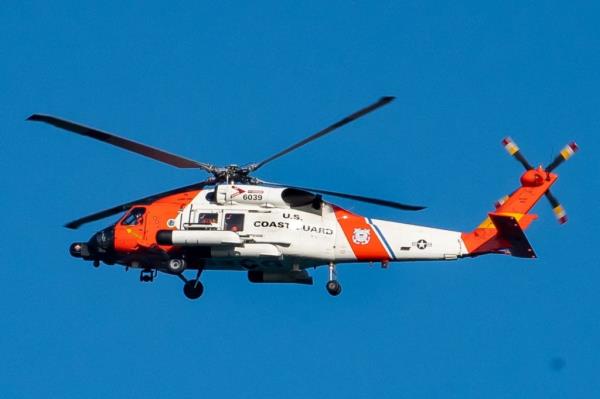 The US Coast Guard is searching for five people after a fishing boat capsized off the coast of Alaska.
