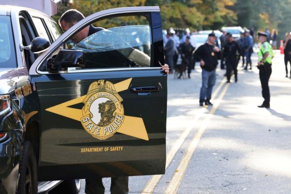 Massachusetts State Police and New Hampshire State Police search the Ames Nowell State Park in Abington, Mass. on Oct. 20, 2021.