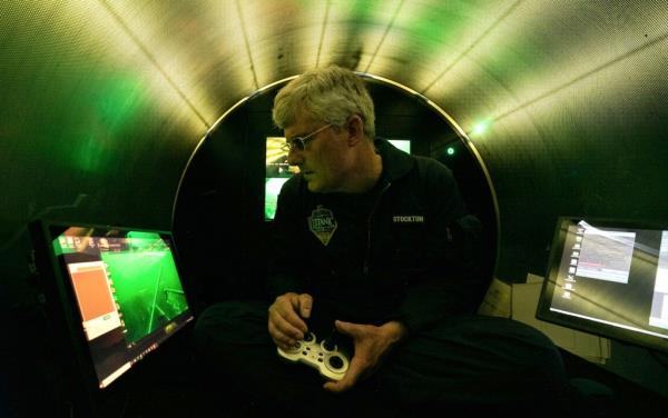 OceanGate Expeditions CEO and co-founder Stockton Rush seen inside the Titan submersible. 
