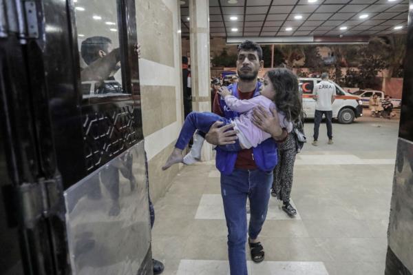 Palestinians injured in Israeli raids arrive at Nasser Medical Hospital on Nov. 14, 2023 in Khan Yunis, Gaza. 