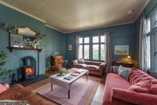 A cozy living area with a fireplace, one of several inside.