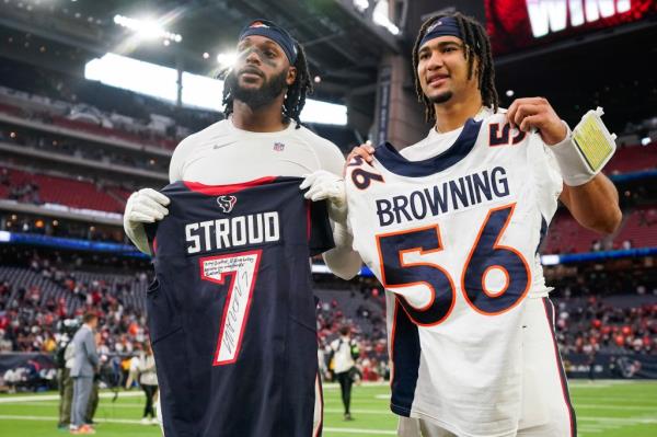 Baron Browning, left with C.J. Stroud of the Texans