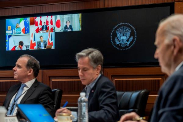 President Biden, right, and Secretary of State Antony Bl<em></em>inken, center, speak with G7 leaders on Sunday.