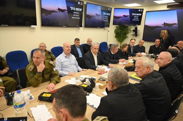 This handout picture courtesy of the Israeli Prime Minister's Office taken on April 14, 2024 shows Israel's Primr Minister Benjamin Netanyahu (C) during a War Cabinet meeting at the Kirya in Tel Aviv. Iran's Revolutio<em></em>nary Guards co<em></em>nfirmed early April 14, 2024 that a drone and missile attack was under way against Israel in retaliation for a deadly April 1 drone strike on its Damascus consulate. (Photo by Israeli Prime Minister Office / AFP) / RESTRICTED TO EDITORIAL USE - MANDATORY CREDIT 