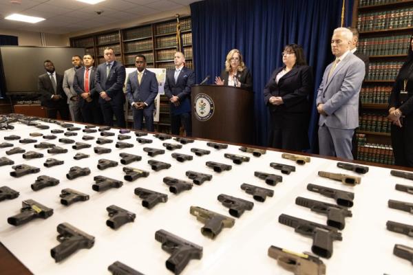 Queens District Attorney Melinda Katz along with NYPD Captain Jeffrey Heilig hold a press co<em></em>nference in the Queens D.A.as office a<em></em>bout an interstate gun trafficking ring