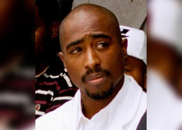 In this file photo, Tupac Shakur attends a voter registration event in South Central Los Angeles on Aug. 15, 1996.