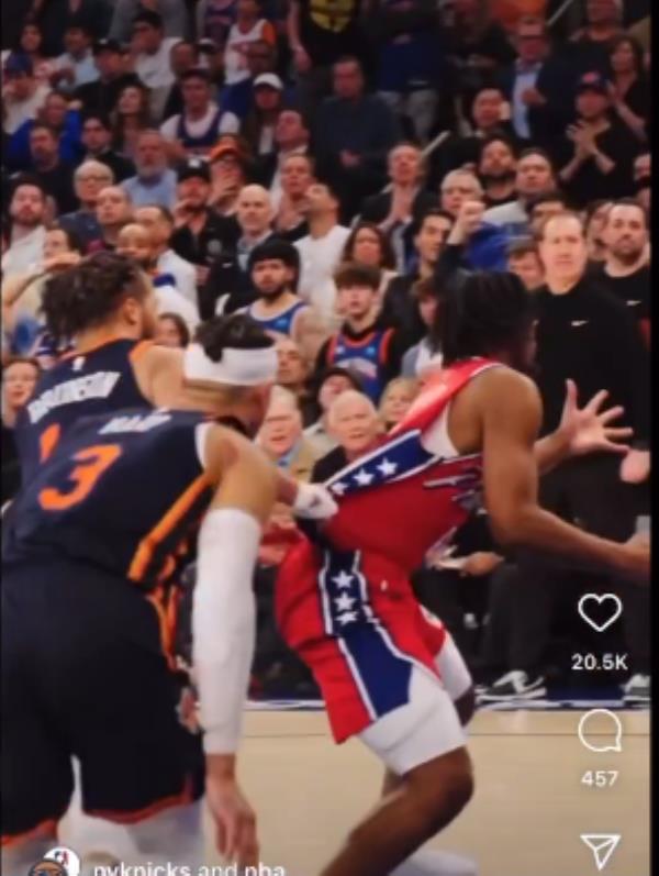 Jalen Brunson grabs Tyrese Maxey's jersey.