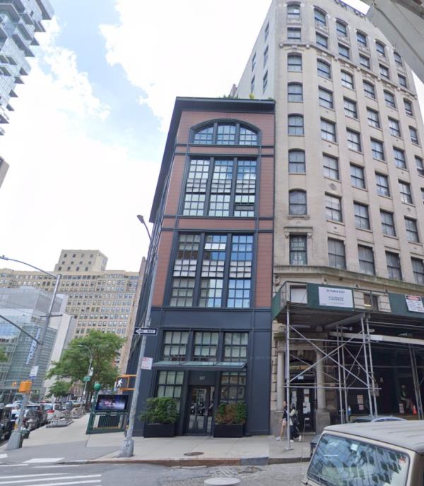 Tribeca penthouse at 137 Franklin Street, New York, a large building with many windows, sold by Brandon Miller in 2021 for $9 million
