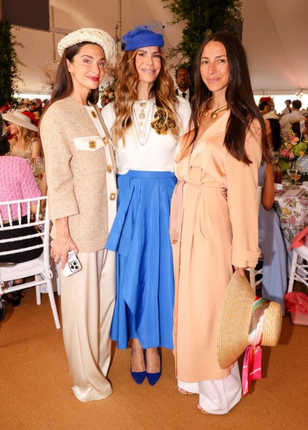 Candice Miller, Gayle Perry, and Arielle Charnas posing at Central Park Conservancy's 42nd Annual Frederick Law Olmsted Awards Luncheon at Co<em></em>nservatory Garden, NYC