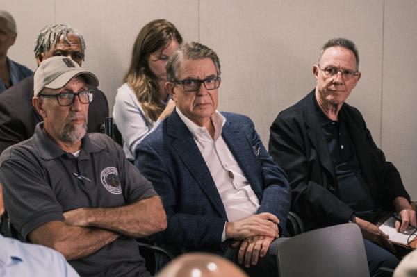 Ian Bruce Eichner (far right), the CEO and chairman of Co<em></em>ntinuum Company, sits with his team at their case to the NYC Department of City Planning. 