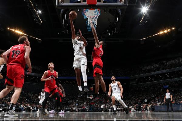 Cam Johnson, who scored 32 points, rises up for a layup during the Nets' preseason loss to the Raptors.