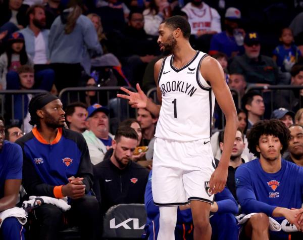 Mikal Bridges of the Brooklyn Nets reacts in front of the Knicks bench after hitting a three point shot during the second half when the New York Knicks defeated the Brooklyn Nets 105-93 Saturday, March 23, 2024