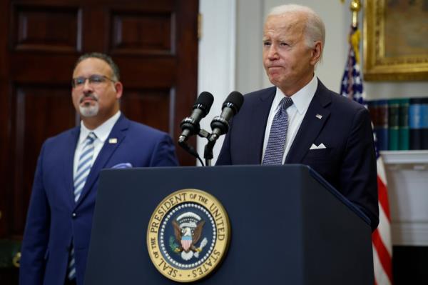 Education Secretary Miguel Cardona and President Biden