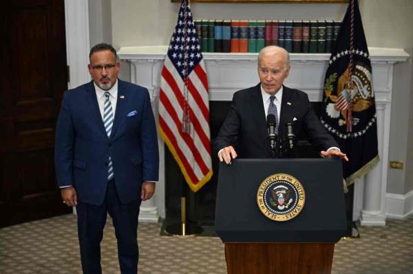 Education Secretary Miguel Cardona and President Biden
