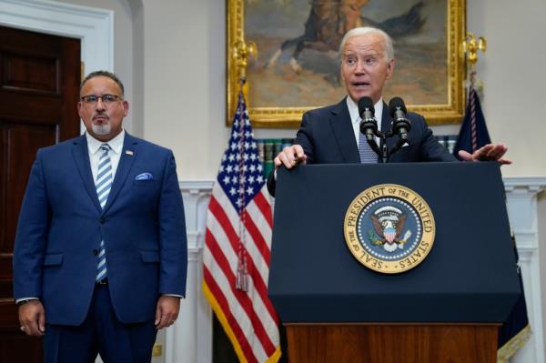 Education Secretary Miguel Cardona and President Biden