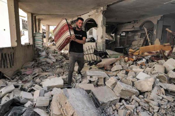 After troops left Wednesday morning, residents began emerging from their homes. They found streets lined by scorched and flattened cars and piles of rubble.