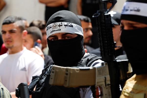 It said the gunmen threatened forces moving out of the camp. Israeli and Palestinian officials also reported fighting near a hospital in Jenin late Tuesday.
