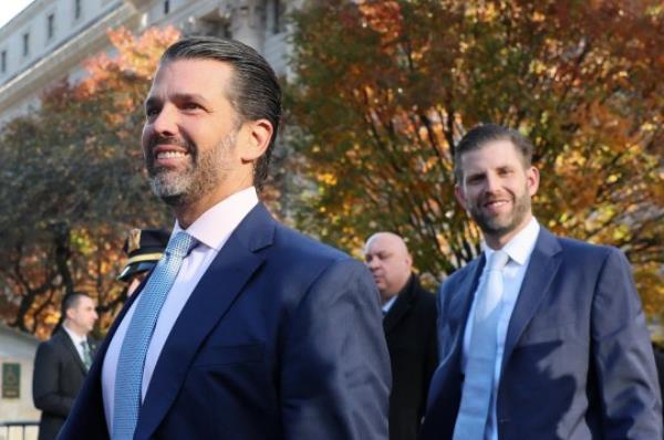 Former President Do<em></em>nald Trump's sons and co-defendants Do<em></em>nald Trump Jr (left) and Eric Trump (right) walk to attend the Trump Organization civil fraud trial on New York Supreme Court