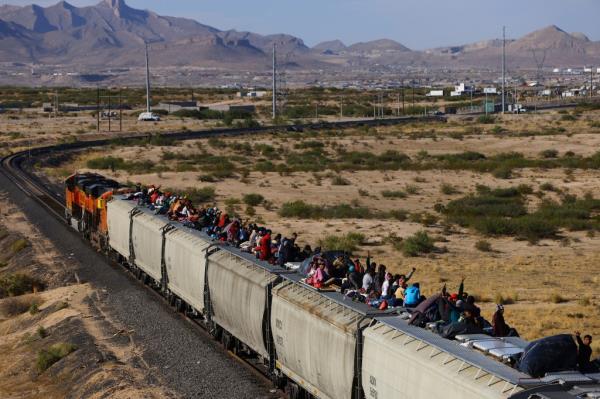 Migrants have been hitching rides on trains as they work their way to the border from South and Central America