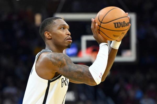 Brooklyn Nets guard Lo<em></em>nnie Walker IV (8) shoots in the second quarter against the Cleveland Cavaliers at Rocket Mortgage FieldHouse.