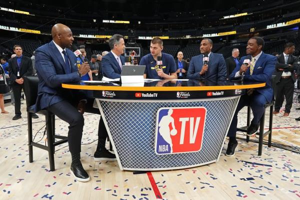 Nikola Jokic #15 of the Denver Nuggets talks to the NBA TV crew.