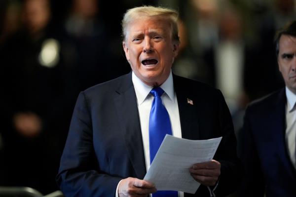 Former President Do<em></em>nald Trump speaks to members of the media at Manhattan Criminal Court, Thursday, May 30, 2024, in New York.