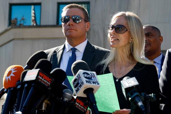 Holloway's mother Beth and brother Matt speaking to the media outside of the Hugo L. Black Federal Courthouse in Birmingham, Alabama on October 18, 2023.