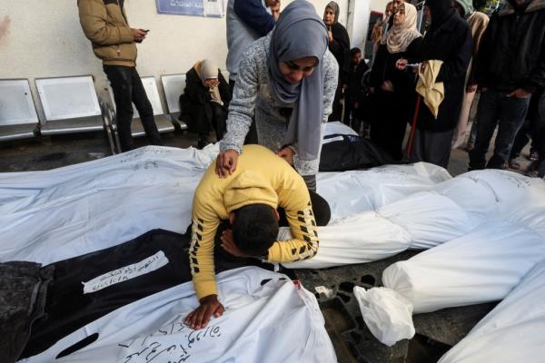 Mourners react next to bodies of Palestinians, most of whom were killed in Israeli strikes, amid the o<em></em>ngoing co<em></em>nflict between Israel and the Palestinian Islamist group Hamas, at Abu Yousef al-Najjar hospital in Rafah in the southern Gaza Strip on Feb. 8, 2024.