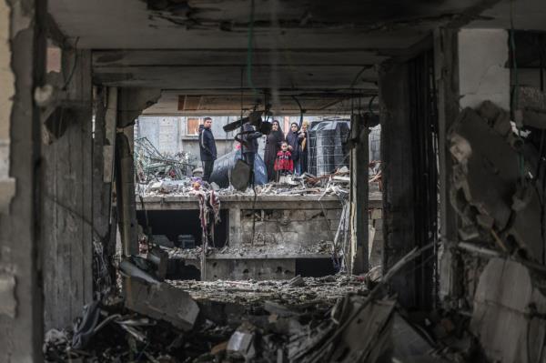 People assess the damage caused by Israeli bombardment in Rafah, in the southern Gaza Strip, on Feb. 9, 2024. 