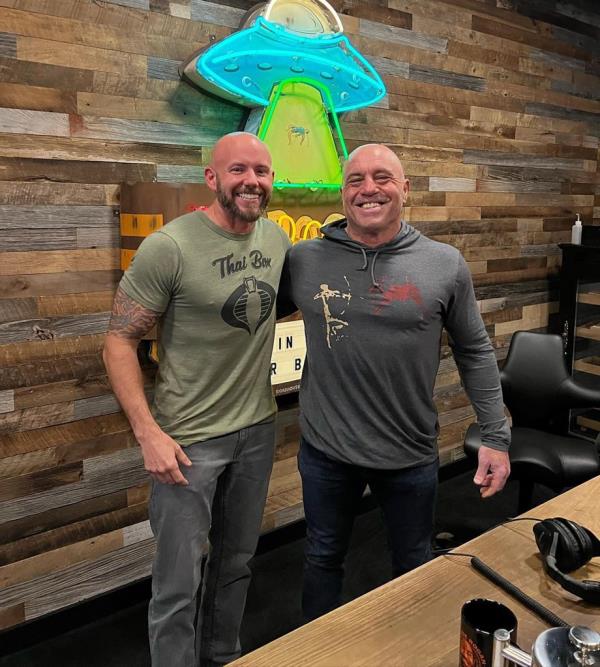 ReviveRx co-founder Brigham Buhler (left) and Joe Rogan (right) standing together during a podcast discussion a<em></em>bout the pharmaceutical industry