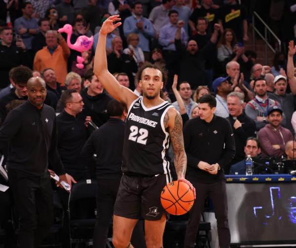 Friars guard Devin Carter (22) celebrates at the end of the second half when the Providence Friars defeated the Creighton Bluejays 78-73 in the Big East Tournament.