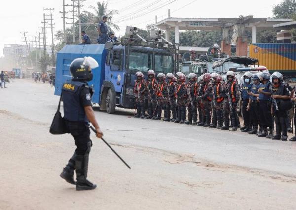 1 killed as garment workers clash with police in Bangladesh over pay rise