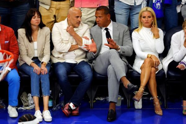 Timberwolves minority owners Marc Lore and Alex Rodriguez look on in the second half against the Dallas Mavericks 