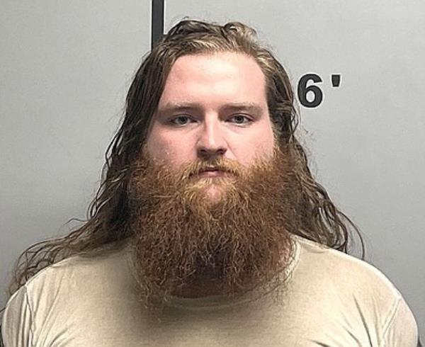 Co<em></em>ney is pictured in a mugshot.
