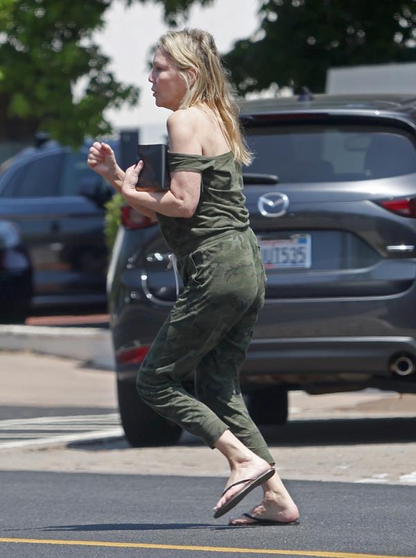Heather Locklear sparks major fears for her perso<em></em>nal safety as she is seen precariously balancing herself along the edge of a tall office building whilst appearing to be in some sort of distress. 