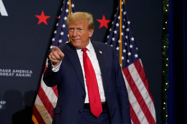 Former President Do<em></em>nald Trump greets supporters as he arrives at a commit to caucus rally, Tuesday, Dec. 19, 2023.