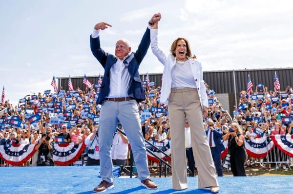 Democratic presidential nominee Vice President Kamala Harris is welcomed by running mate Democratic vice presidential nominee Minnesota Gov. Tim Walz before she delivers remarks at a campaign rally in Eau Claire, Wis., Wednesday, Aug. 7, 2024