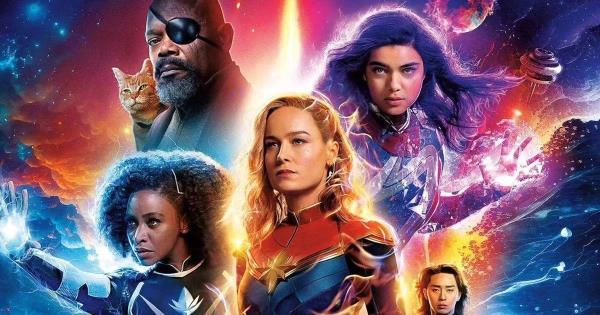 The cast of The Marvels including Brie Larson, Teyo<em></em>nah Parris, Iman Vellani, and Samuel L. Jackson in a poster for The Marvels wher<em></em>e they show their powers with a lot of bright, colorful imagery.