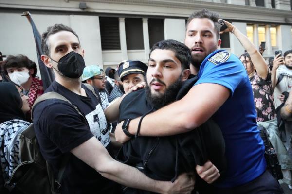 Members of the New York City Police Department arrest a pro-Palestinian demo<em></em>nstrator during? protests on the first anniversary of Hamasas October 7 attack on Israel on Monday, October 7, 2024 in New York, N.Y.  