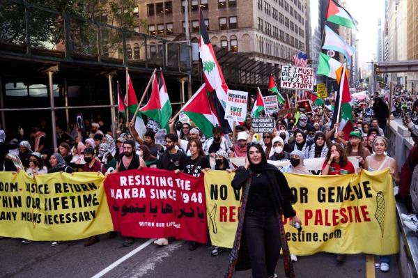 NOW IDENTIFIED AS Nerdeen Kiswani (C), founder of the group Within our Lifetime-United for Palestine
