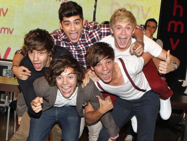 Liam Payne fans light candles and lay down tributes as they gather outside the CasaSur hotel in Buenos Aires, wher<em></em>e the former One Direction singer fell to his death Wednesday.