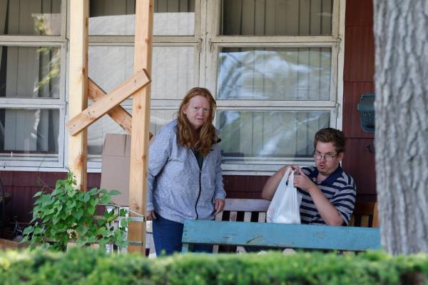 Asa Ellerup (left) and her son Christopher on the front porch of their home on Tuesday.