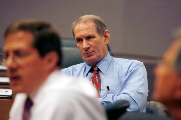 James Crown sits in a meeting