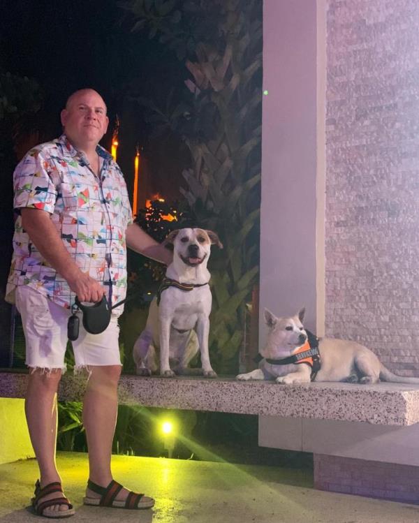 Perman pictured with his dogs, Coco and Skylar 