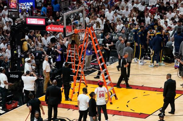 Play is temporarily stopped to check the balance of the basket during the second half of Game 4 of the basketball NBA Finals.