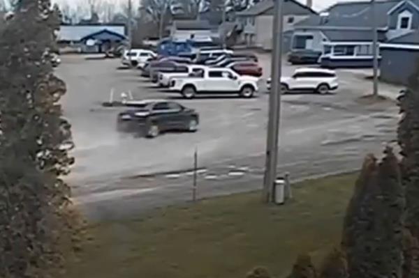 The car speeding toward the building.