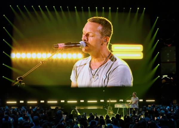 Jo<em></em>nny Buckland, Chris Martin and Guy Berryman of Coldplay perform as the band headline the Pyramid stage during day four of Glasto<em></em>nbury Festival 2024 on June 29, 2024 in Glastonbury, England. 